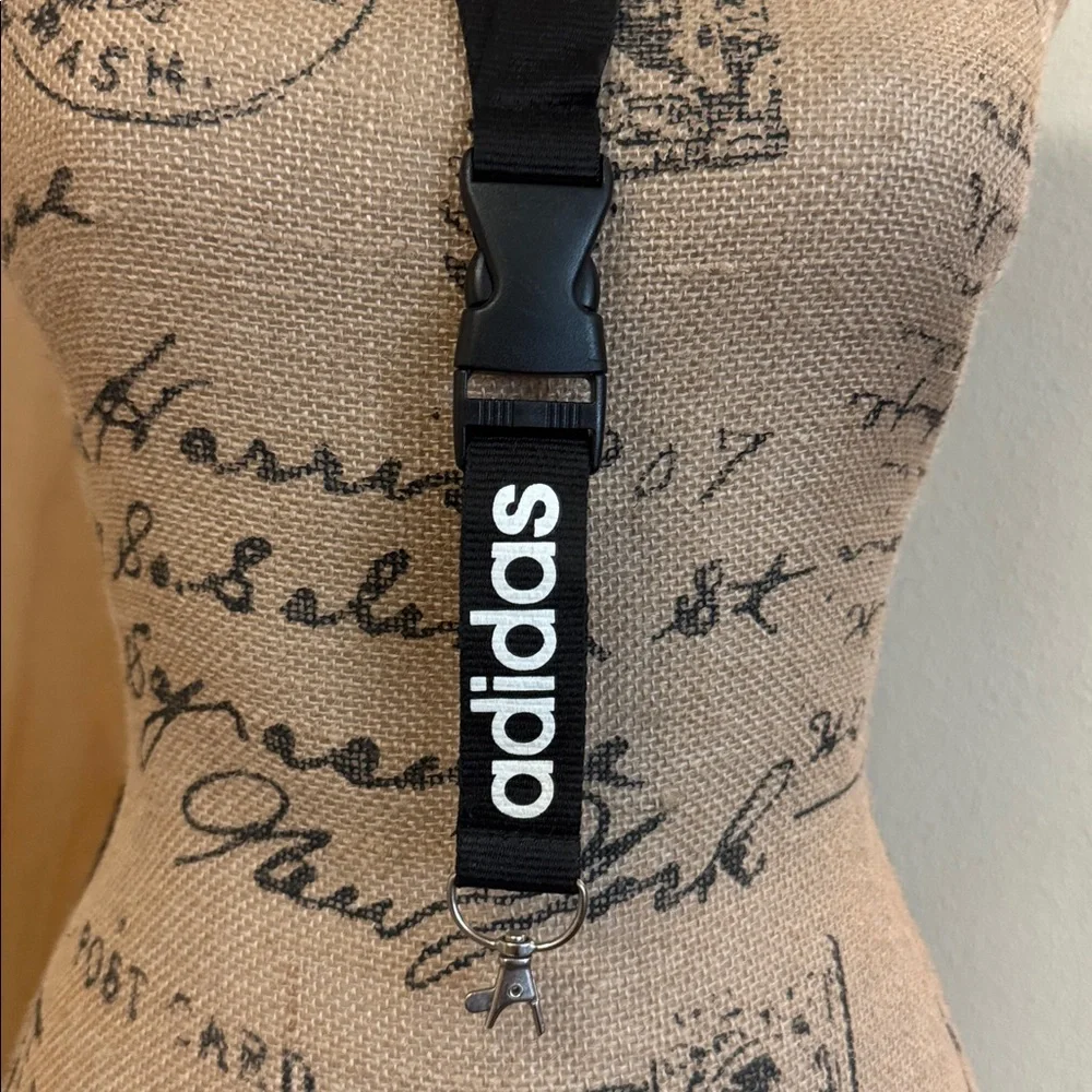 Barely used authentic ADIDAS lanyard with pinch clip off section on bottom.